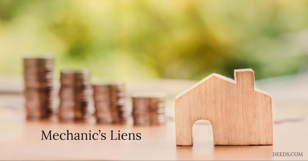 Image of a blurry stack of coins on a table next to a wood block shaped like a house. Captioned: Mechanic's Liens