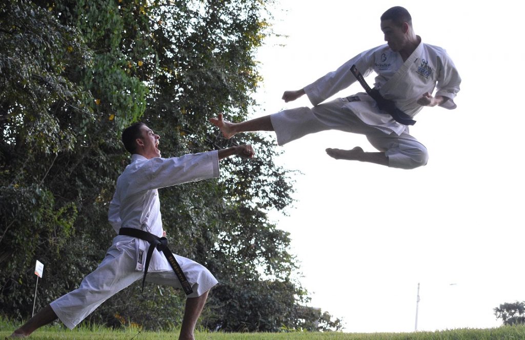 Image of two people practicing martial arts captioned Defending a Quitclaim Deed.