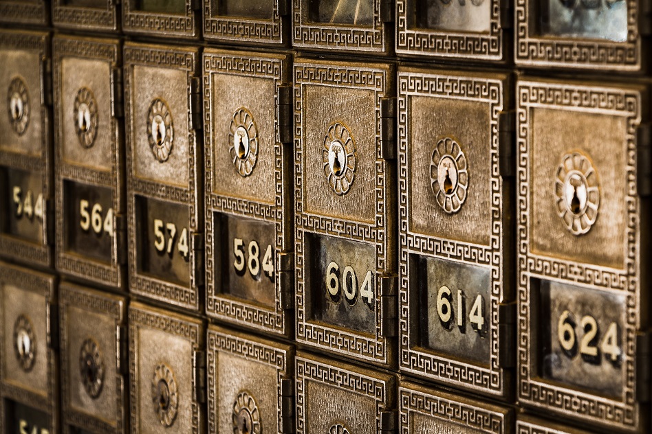 Image of a row of safety deposit boxes. Captioned: It’s Storm Season. Do You Know Where Your Deed Is?