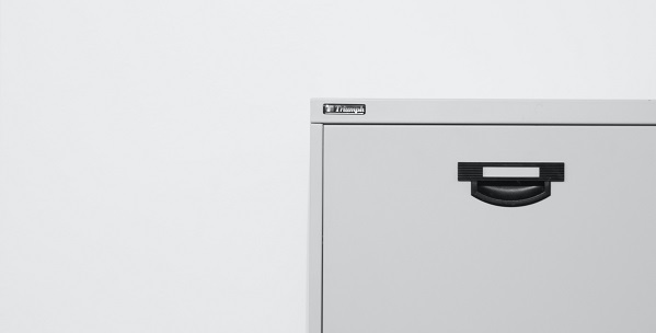 Image of a basic filing cabinet. Captioned: Modernizing an Archaic Notary System for Real Estate Documents.
