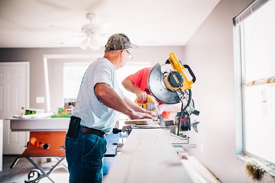 Image of a person working inside a house doing a remodel.