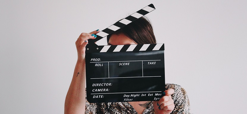 Image of a person holding a moving board. Captioned: On Stage and Behind the Scenes in a Mortgage