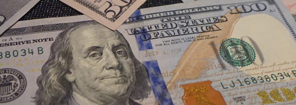 Image of U.S. paper currency. Captioned: How to Replace Your Current Mortgage With Cash-Out Refinancing