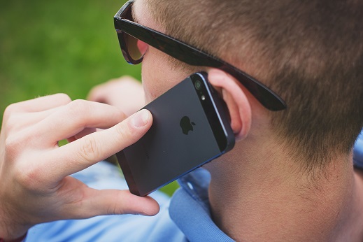 Image of a person talking on a cell phone.