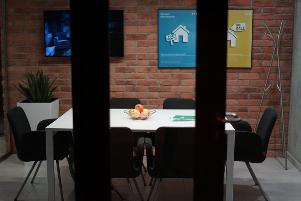 Image of a conference room at a real estate closing office. Captioned: What are fiduciary duties?