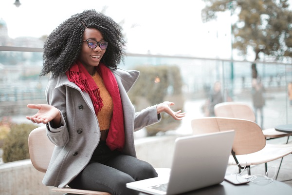 Image of a person seeming happily surprised while looking at a computer. Captioned: Assumable Mortgages Never Looked Better