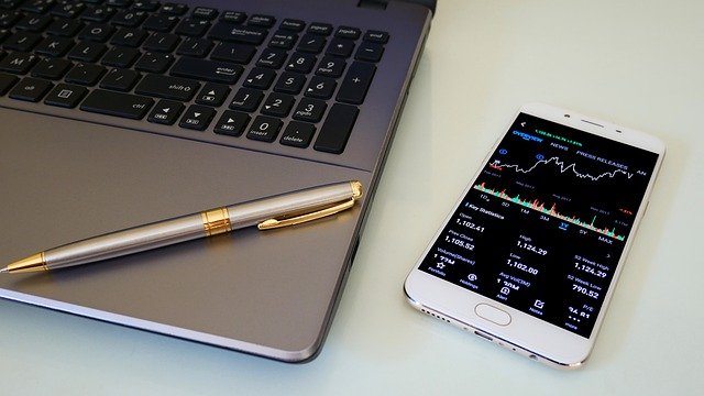 Image of a pen sitting on a computer keyboard with a cell phone next to it. Captioned: Averting Misuse by Bad Actors