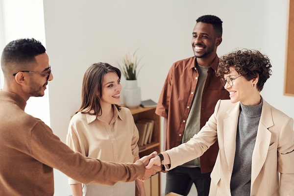 A small group of people at a real estate closing.
