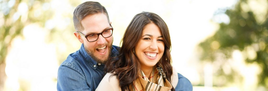 Image of a married couple looking very happy about their first quitclaim deed... real estate.