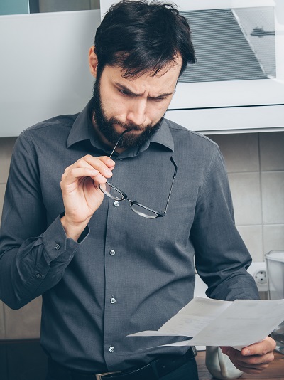 Image of a person studying a legal document.