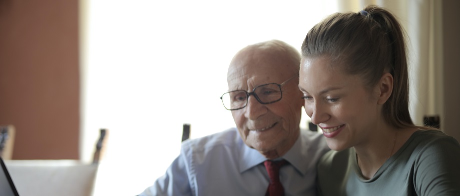 Image of two people reviewing a mortgage and discussing end of life plans.