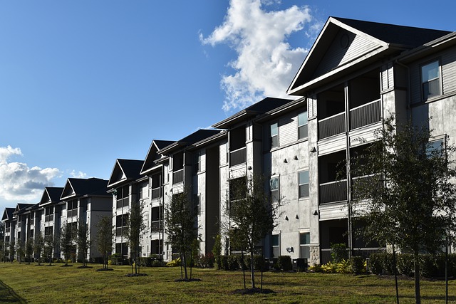 Image of the outside of a row of condominiums. Captioned: Solving the Affordability Problem
