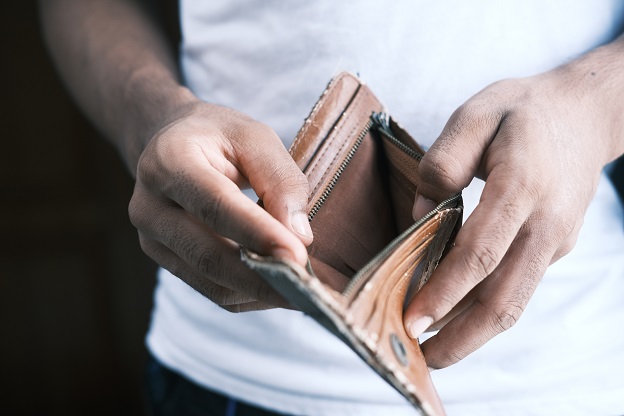 Person holding an empty wallet.