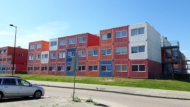 Image of the outside of container homes being used as student housing