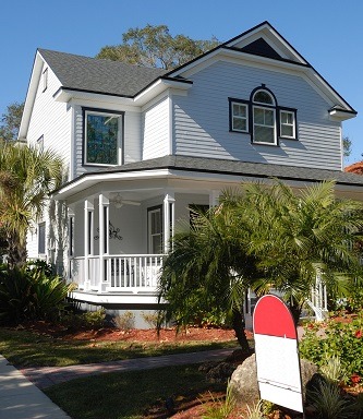 Image of the outside of a vacant house that is for sale with little activity