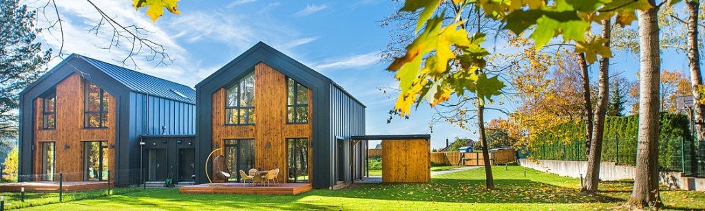 Outside view of two houses standing side by side in an idyllic setting