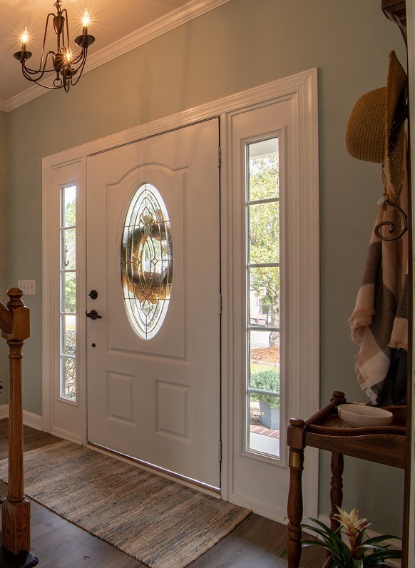 Image of the front door of a house from the inside of the house. Captioned: What a Phenomenal Year 2021 was for Real Estate.