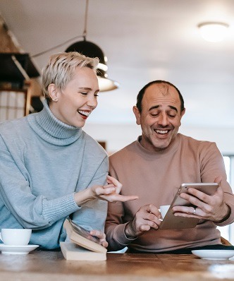 Two people building their virtual dream home