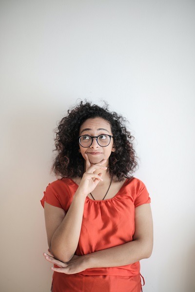 Person in deep thought about how much money they hove for a down payment for real estate