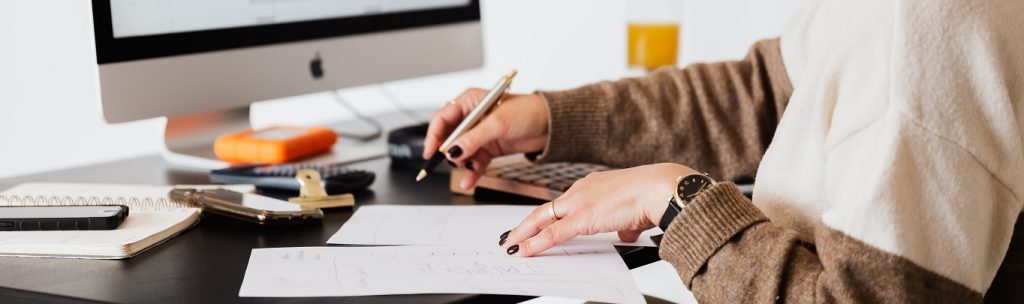 Person at a desk working on lien paperwork