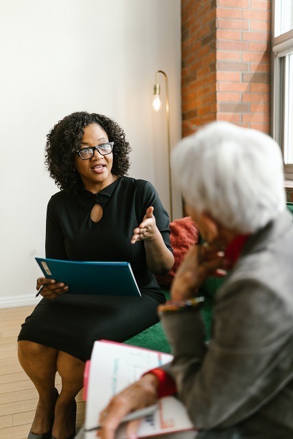 Image of two people discussing beneficiaries on a beneficiary deed