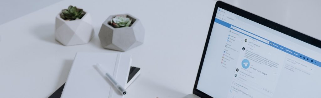 Image of a computer with real estate listings on the screen.