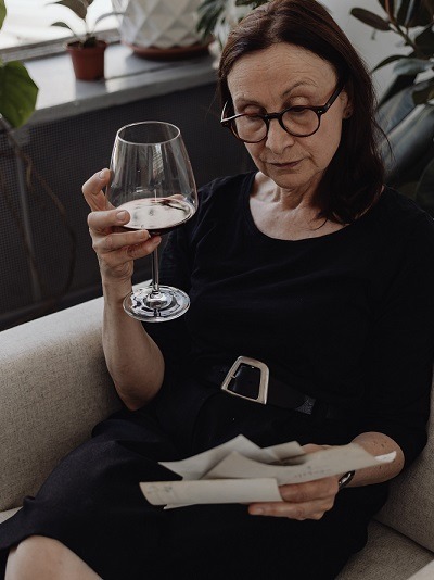 person sitting on a couch looking at paperwork