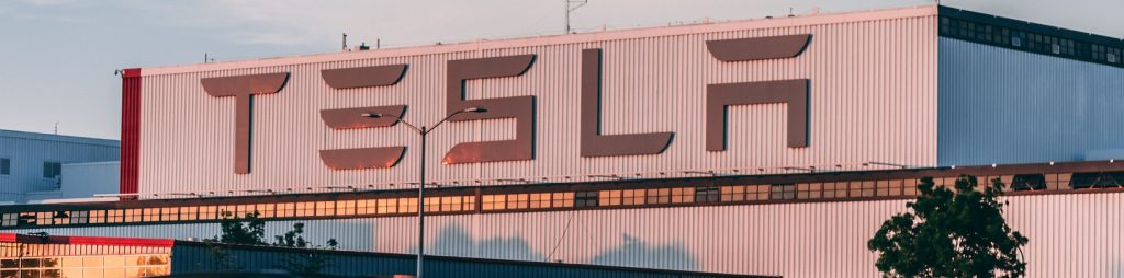 image of an industrial building with the TESLA name on it.