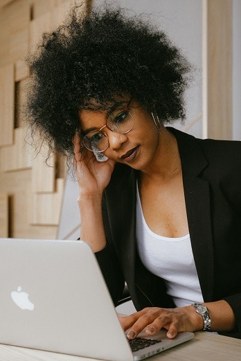 person reviewing a hardship letter on their computer